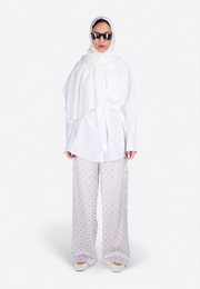 Model wearing EastVibe embroidered white scarf, front-side view – East Vibe